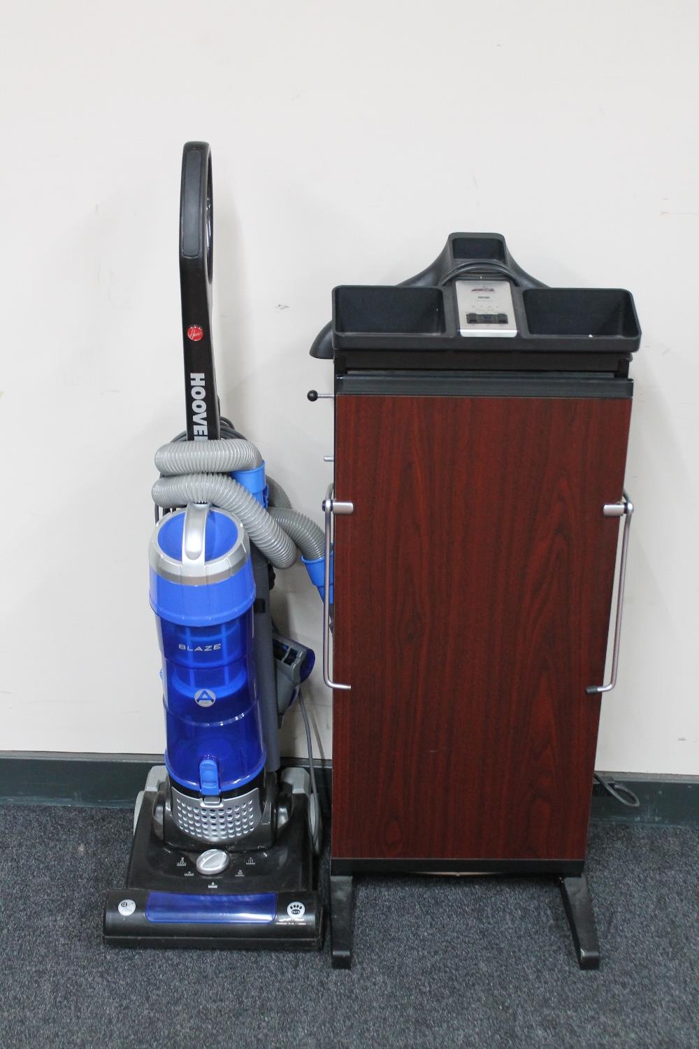 A Hoover Blaze upright vacuum together with a Corby trouser press