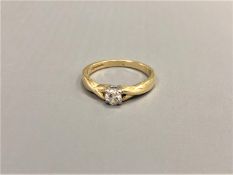 An 18ct gold diamond solitaire ring, approximately 0.2ct, size N 1/2.