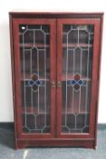 A mahogany effect double door bookcase