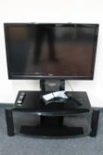 A Hitachi 42 inch LCD TV on stand with remote (no table stand)