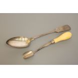 A large Newcastle silver basting spoon together with an ivory handled Newcastle silver butter or