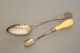 A large Newcastle silver basting spoon together with an ivory handled Newcastle silver butter or