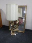 A gilt framed bevelled mirror together with a gilt chalk table lamp and shade