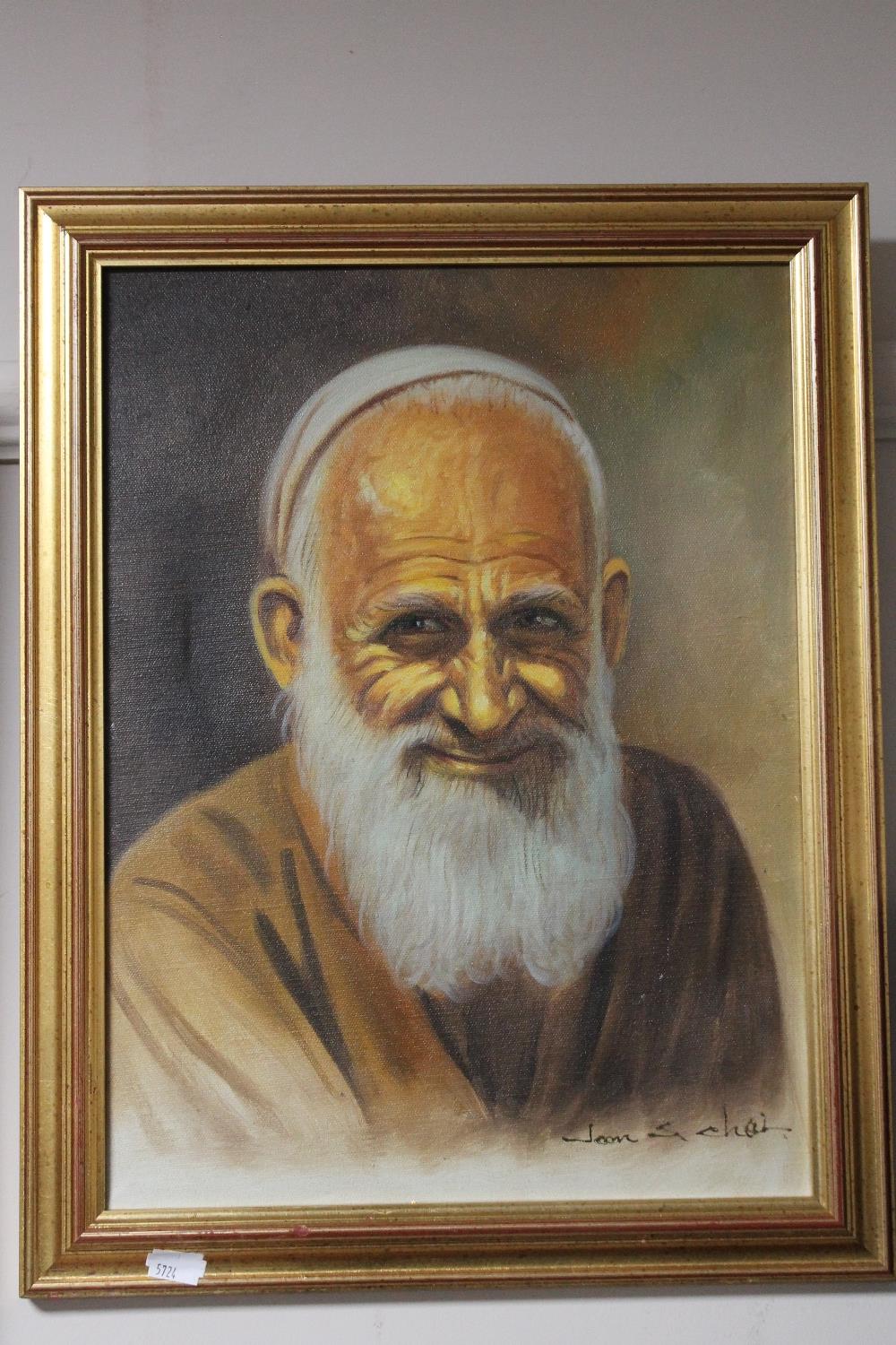 A gilt framed oil on canvas depicting a village elder