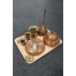A tray containing antique brass and copper wares including a copper bed warmer,
