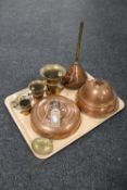 A tray containing antique brass and copper wares including a copper bed warmer,