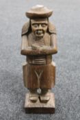 A 20th century carved wooden figure of a Quaker