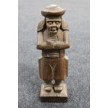 A 20th century carved wooden figure of a Quaker