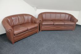 A three seater brow leather settee with matching two seater settee