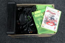 An Xbox 360 with leads and controller together with a quantity of assorted games