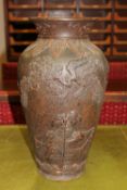 A large early 20th century Japanese pottery vase decorated with Samurai,