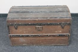 An early 20th century wooden bound shipping trunk