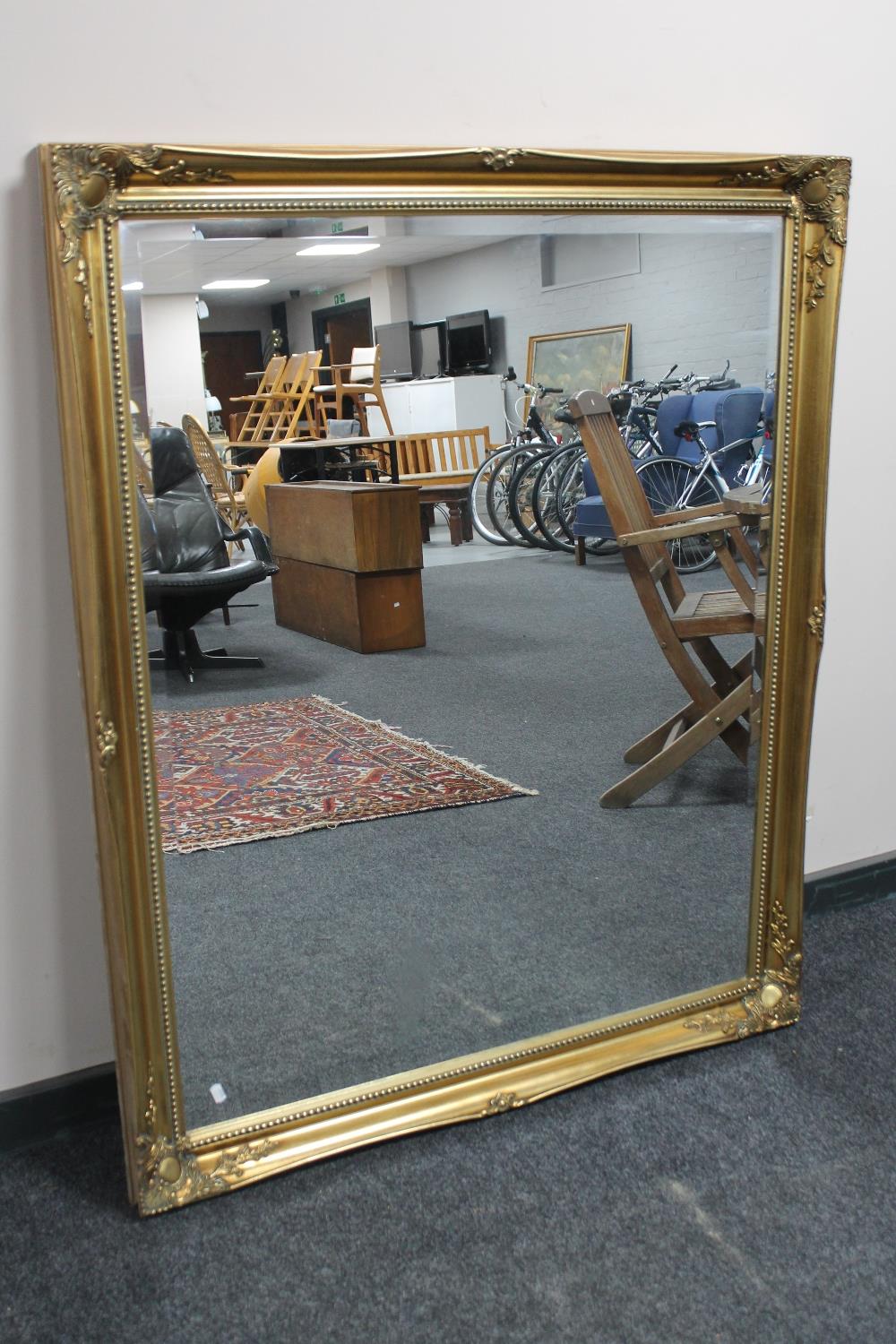 A Victorian style gilt framed bevelled mirror