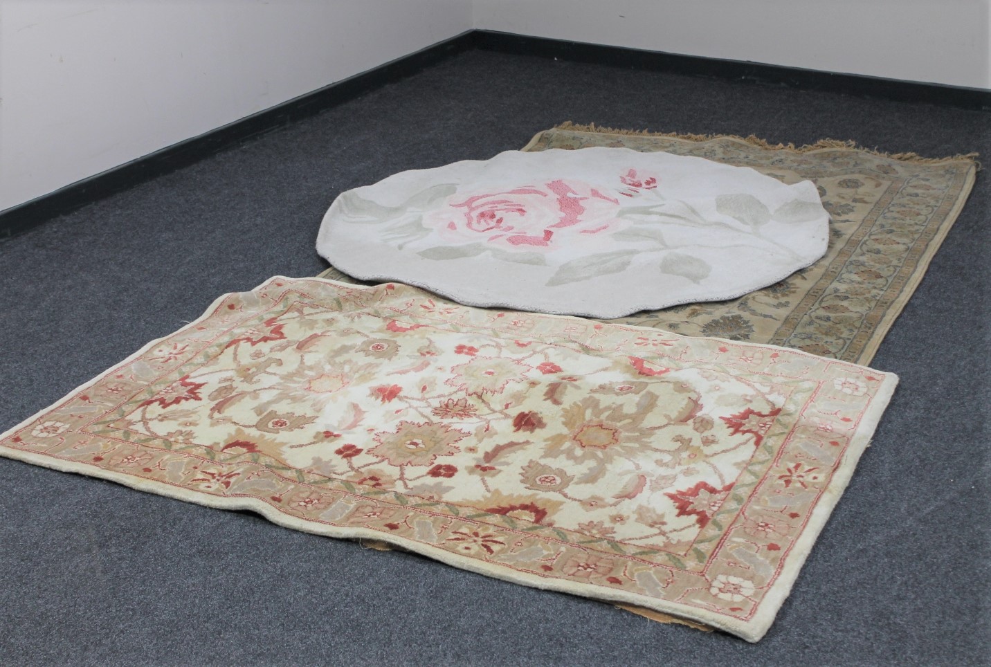 Three floral woollen rugs