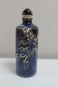 A Chinese blue glazed pottery scent bottle with lizard decoration CONDITION REPORT: