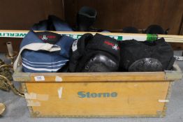 A box of two pairs of inline skates, pair of roller boots in carry bag,