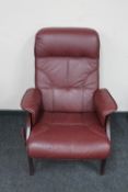 A late 20th century maroon leather adjustable armchair