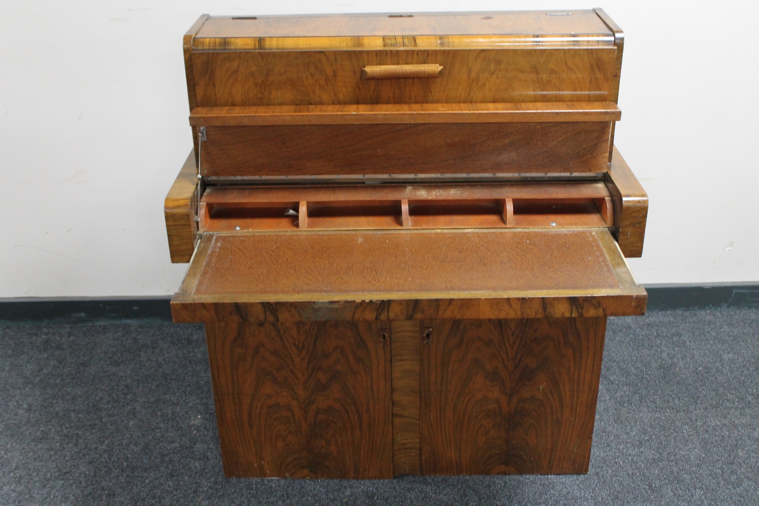 A walnut Art Deco cocktail cabinet / writing desk in the form of a mini piano CONDITION