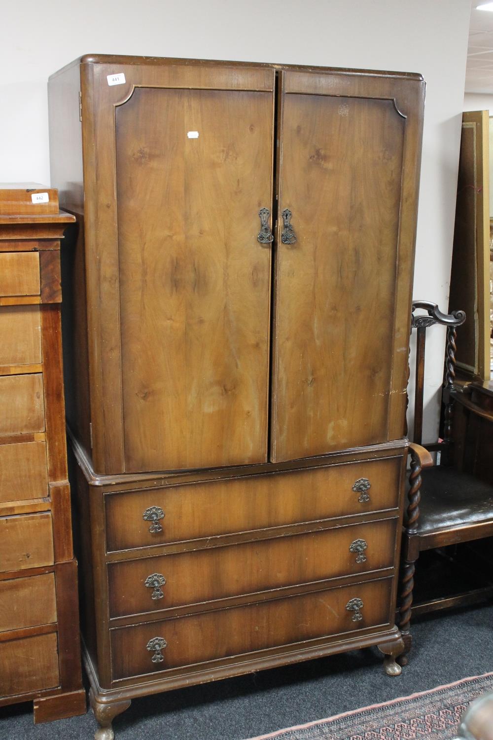 A walnut wardrobe fitted three drawers beneath CONDITION REPORT: 92cm wide.