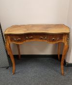 A French figured walnut side table fitted with three drawers,