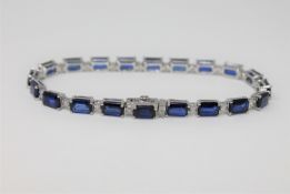 A 14ct white gold sapphire and diamond tennis bracelet, featuring 20 sapphires 12.