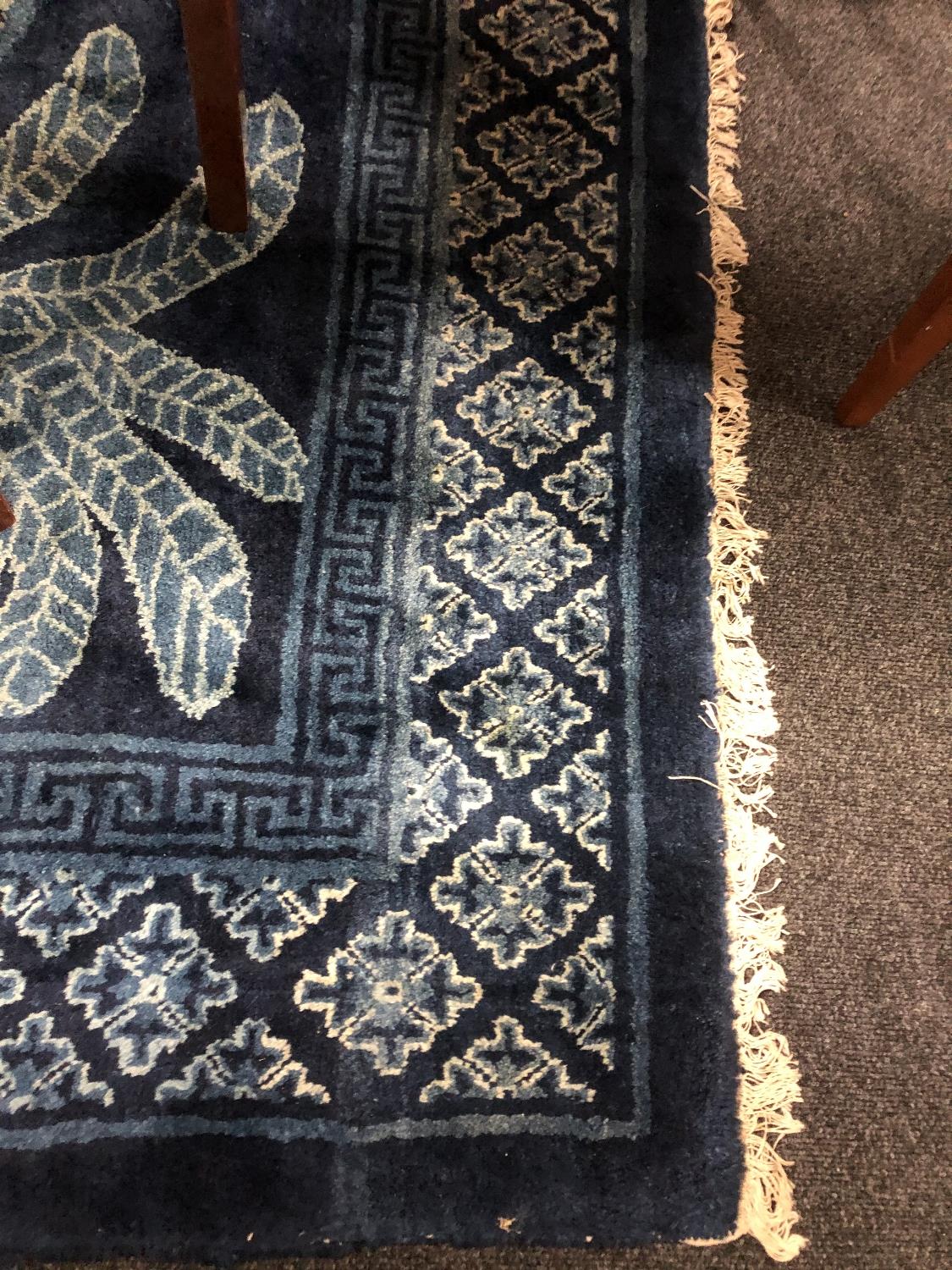 A fringed Chinese rug on blue ground depicting fauna, - Image 5 of 11