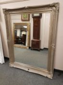 A Victorian style silvered overmantel mirror 119 cm x 115 cm