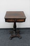 A Victorian pedestal work table fitted a drawer