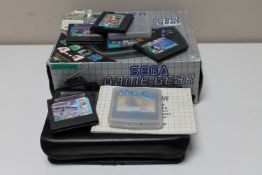 A boxed Sega Game Gear hand held games console, together with another in soft case,