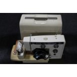 A Riccar electric sewing machine in case
