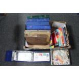 A box of stamp albums and Stanley Gibbons folders of stamps,