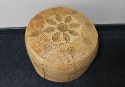 A leather Moroccan style footstool