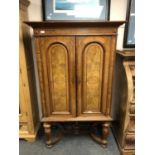 An Edwardian walnut double door side cabinet,