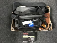 A box of Panasonic video camera with accessories in bag, Polaroid camera, Pentax digital camera,