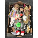 A box of five porcelain headed clown dolls