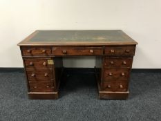 A Victorian mahogany twin pedestal desk fitted nine drawers