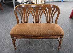 A stained beech bench on turned legs