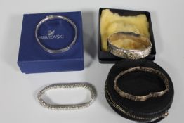 Four silver bracelets and bangles