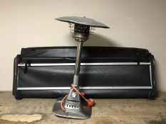 A table top gas patio heater together with an awning