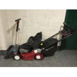 A Mountfield M3 self drive petrol lawn mower with grass box together with a Black & Decker lawn