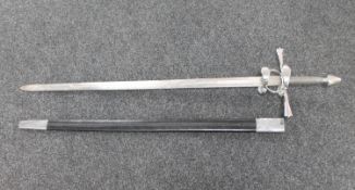 A replica twin handed sword with ornate hand guard