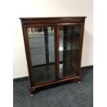 A double door mahogany display cabinet