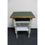 A 20th century painted three tier side table