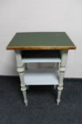 A 20th century painted three tier side table