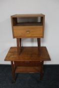 A mid 20th century teak sewing table and a teak effect bedside stand fitted a drawer