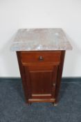 An antique continental mahogany marble topped pot cupboard