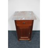 An antique continental mahogany marble topped pot cupboard