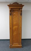 A Victorian pitch pine sentry door wardrobe