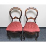 A pair of antique continental mahogany dining chairs on cabriole legs