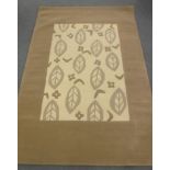 A hand-knotted rug with embossed pattern on cream and brown ground,